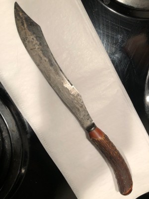 I think these are Meriden. Some one took the grinder to the large one. And the table knife is hard to make out.