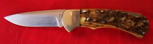 One gnarly stag, oh my, has to be held to be believed, 1977 4" 4 star. Now this knife has character....