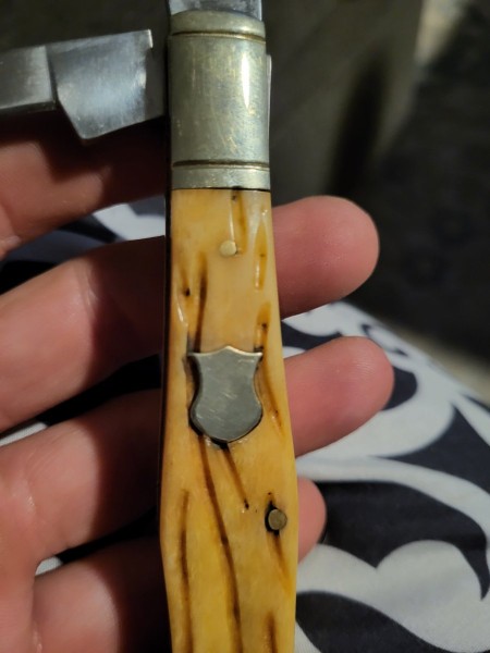 Looking for any info on this knife almost looks brand new but dates to the 40s I know there are knock offs out there but it's solid with no play on the blade. So you or anyone know what it is?