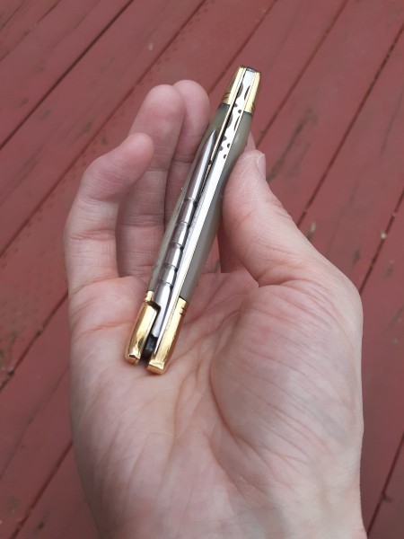 Blade and awl are both offset in the closed position in order to accommodate them without making it a two layer knife.