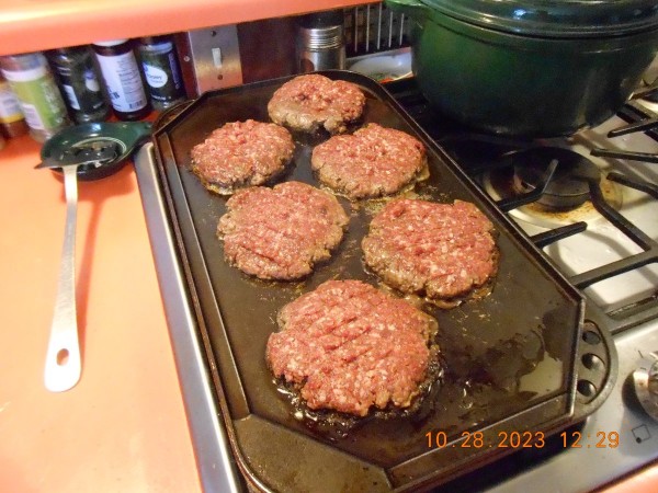 Venison sausage burgers cooking during half time.