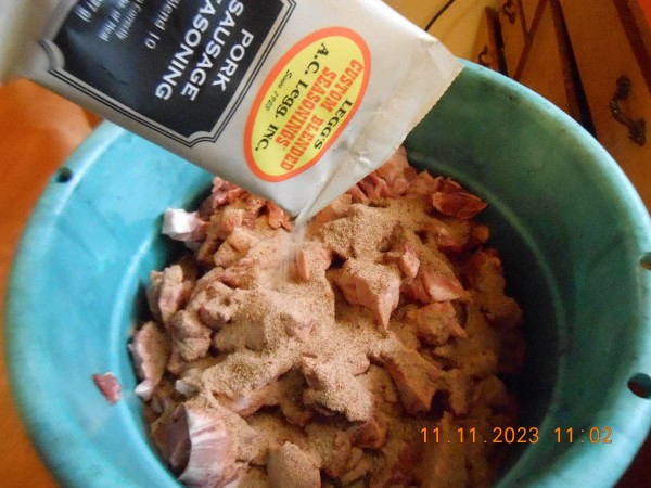 Venison is under the pork in the tub as we are adding 2 packages of Leggs #10 seasoning, also added cayenne and sage to the mix.