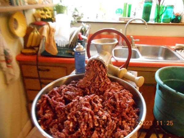 After mixing the pork, venison and seasoning the meat was run through the grinder using a plate with 1/4" holes.