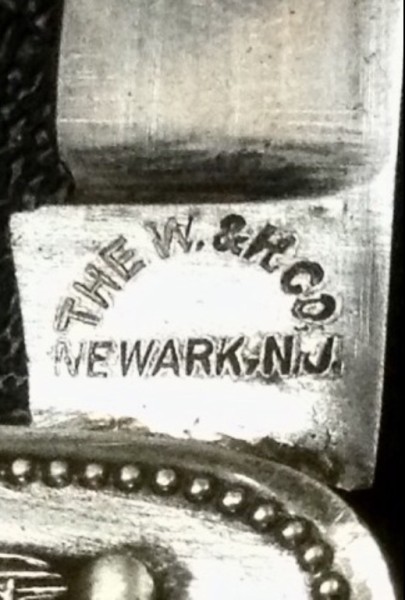 This Is The Style Of ALL Four Tang Stamps Split Between <br />My Two Other, W &amp; H, Travelers Insurance Pocket Knives.<br />ALL Four Tang Stamps Are The Curved Or Arched Style <br />WITHOUT The USA In The Center. NO Block Style Tang Stamp.