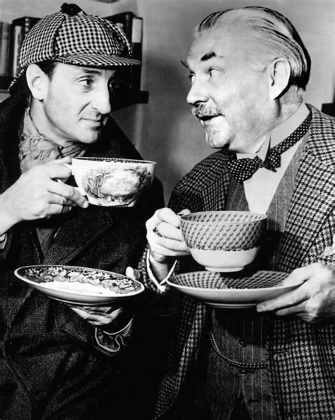 Nigel Bruce as Dr. Watson, with Basil Rathbone as Sherlock Holmes