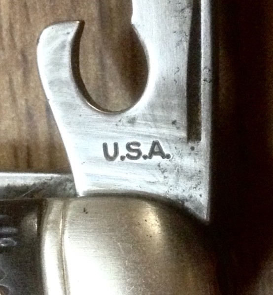 The Can Opener Tool Front Stamp.