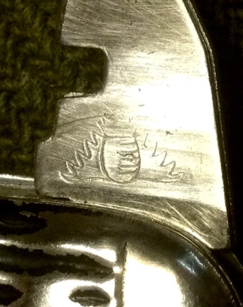 The Glass Cutter Front Stamp.<br />A "Flaming Pineapple"(?)