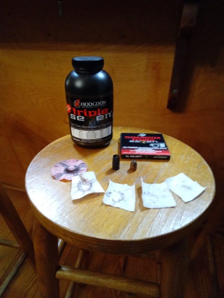 Powder, primers, bullet, sabot and cleaning patches.
