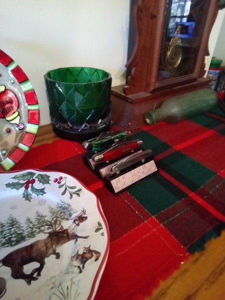 Miss Joy wanted a red, green, and a silver knife for her sideboard. They're all Case knives