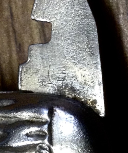 The Glass Cutter Tool Front Stamp. The Remains Are In The Center.<br />A &quot;Flaming Pineapple&quot;(?)