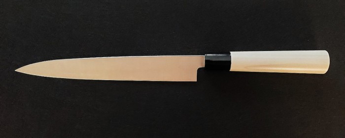 Back of the blade with a slight concave giving the blade a non-stick quality