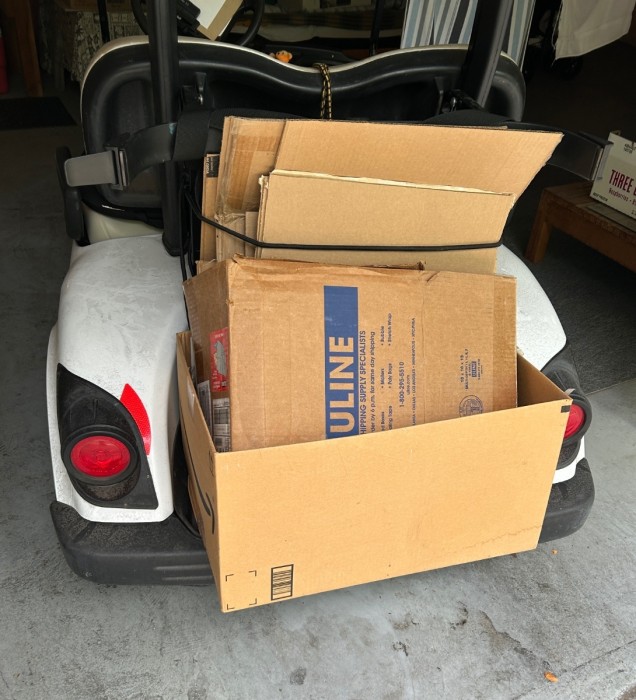 All broken down, loaded on the cart and ready to run to the recycling dumpster
