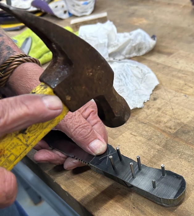 Tapping Pins Into The Master Cover