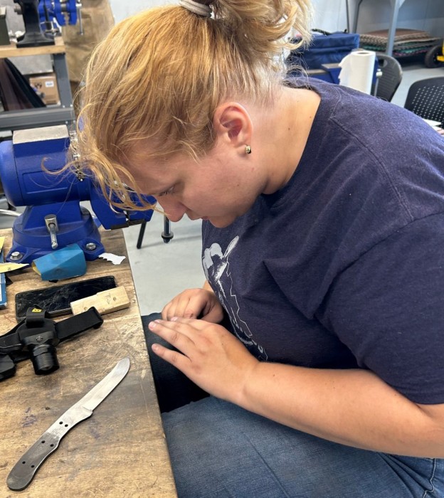 Gabby Hand Sanding At The Bench.jpeg