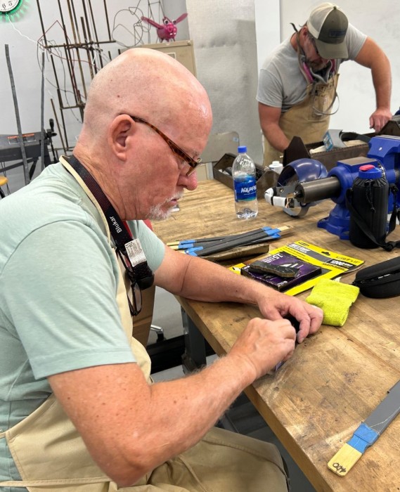 Steve Hand Sanding His Bevel.jpeg