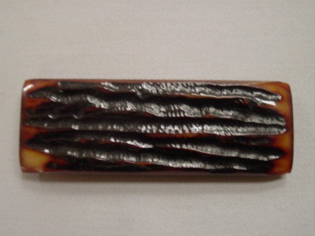 Amber Carved Stag Bone.JPG