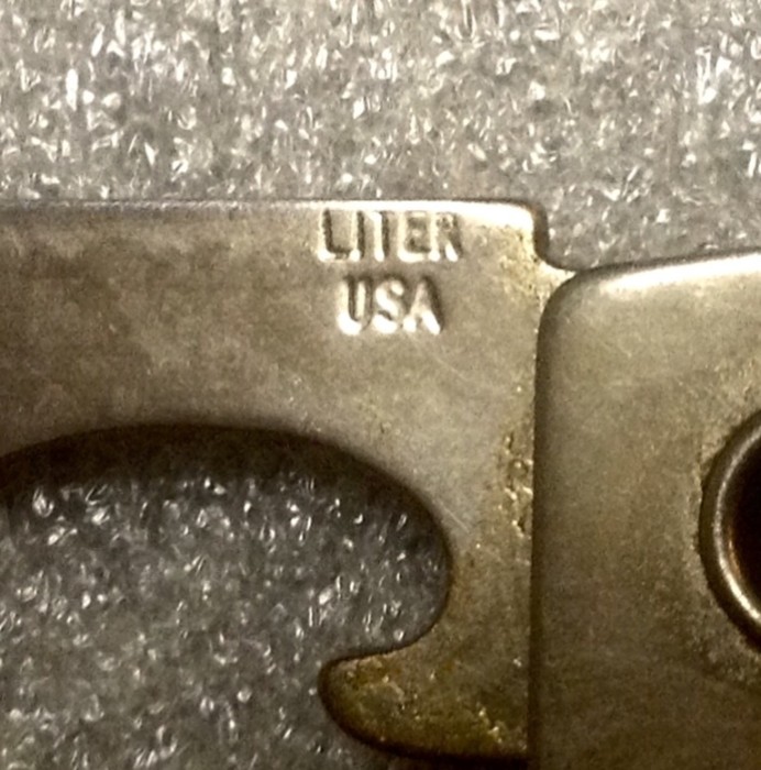 The Cap Lifter/Bottle Opener And Screwdriver Front Stamp.