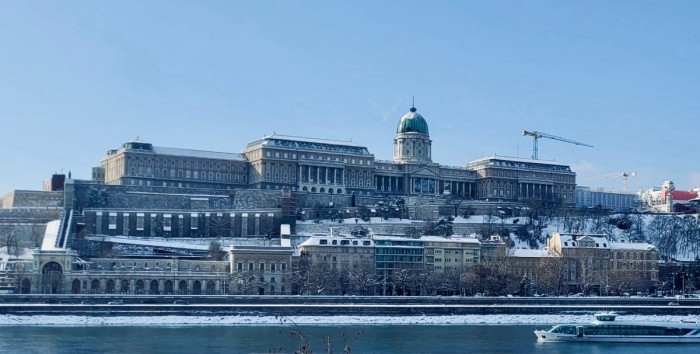Snow-covered Buda Castle Hill with Danube in foreground