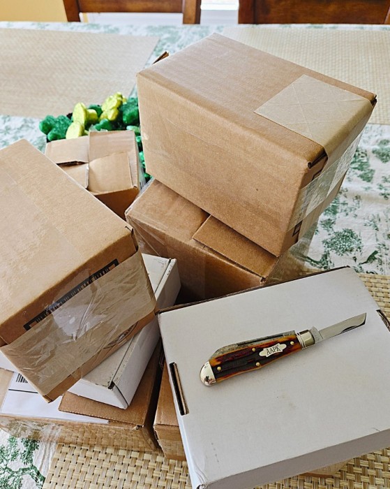 Amber Opening New Knife Packages.jpg