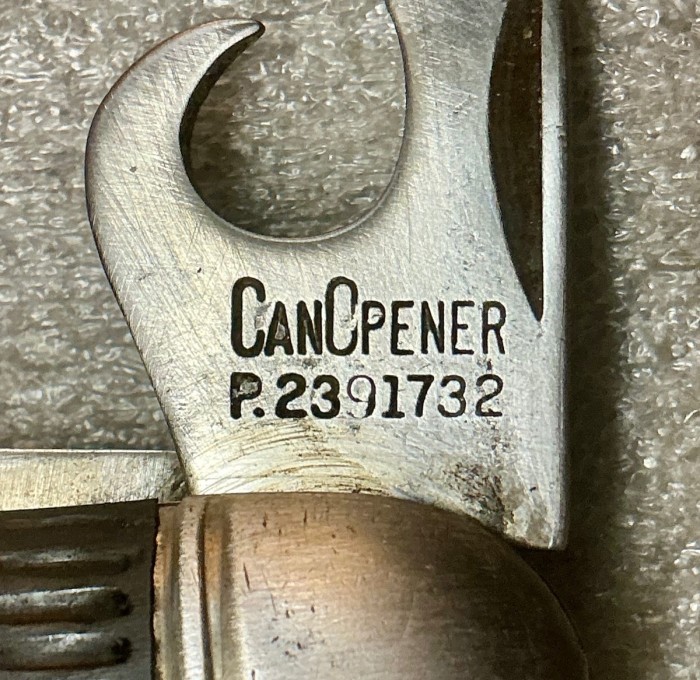 The Can Opener Tool Front Stamp.