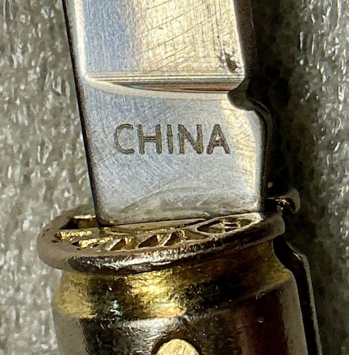 The Main Blade Back Tang Etch.