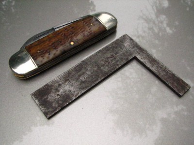 Small square, tapered in thickness.<br />I have framing squares like this, but this unusual