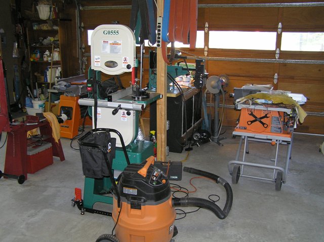Metal cutting bandsaw, wood cutting bandsaw, table saw. The is belt storage for the Bader on a 2x4 mounted on the post. There is about 100 or more belts up there. 6.5 HP shop vac, Boy that thing draws 12 amps. Most of the machines have a dust vent. Some a