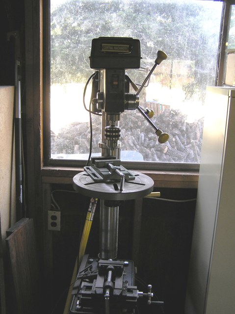Drill press with a couple more vices. The bottom on moves on an x-y axis, so I can use it as a mill on wood. I have a few end mills for that.