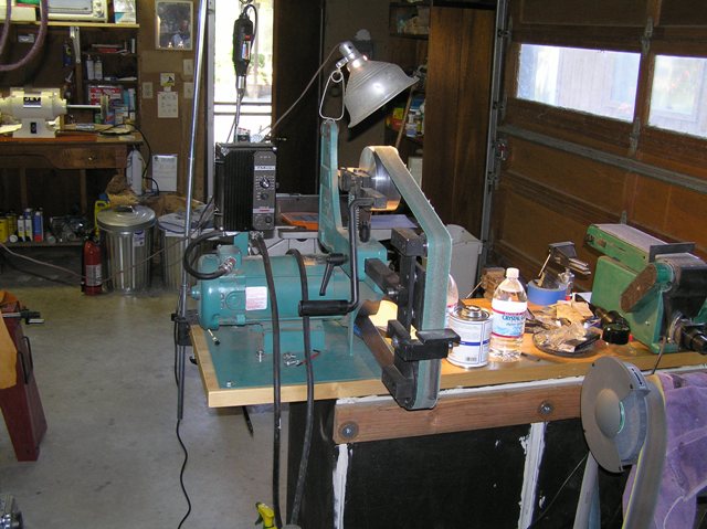 The Bader III, a workhorse. 2 HP 220 volt with the DC controller. A Dremel is mounted behind it, uses a flexible shaft. 4 x 36 sander on the other side of the bench.