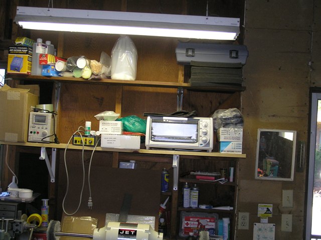 In this mess is a power suppy to etch steel, another to annodize titanium, a turbo carver, buff compounds, vacuum pump, and oven. Glove supply also